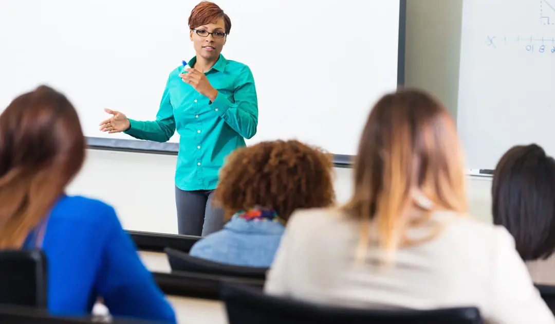 Female professor lecturing a group of students